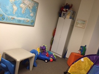 A room with toys and a table in it